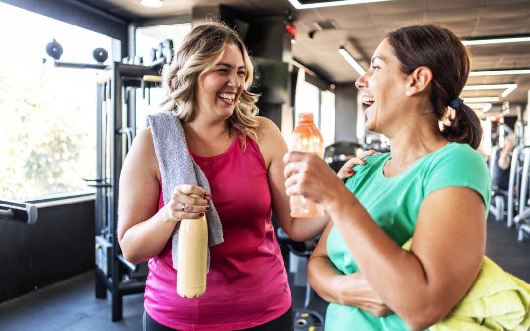 two women talking in apartments with fitness center